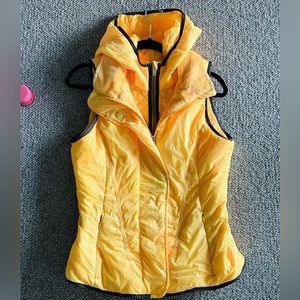Lululemon Glacier double zipper bright yellow vest with a hood. Size 8.